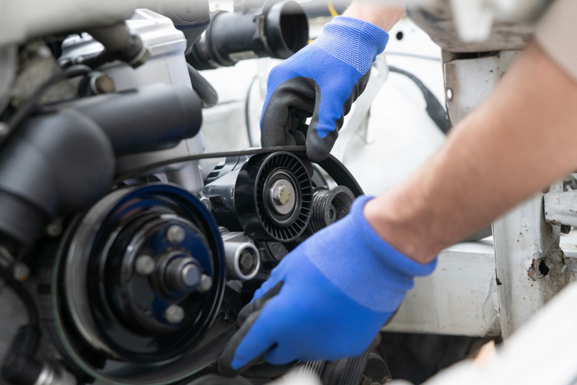 Close-up View of a Car Timing Belt and Pulleys Showcasing Mechanical Components Under the Hood
